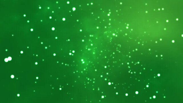 Floating white light particles drift slowly across a vibrant green background in this smooth digital motion animation creating a soft glowing atmosphere perfect for modern creative projects.