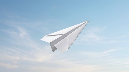 Fototapeta premium White paper plane flying in a clear blue sky representing freedom