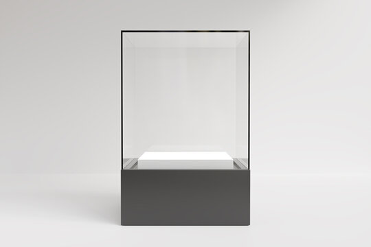 Empty glass display case showcase with black base and white podium isolated on light gray background. 3D render.
