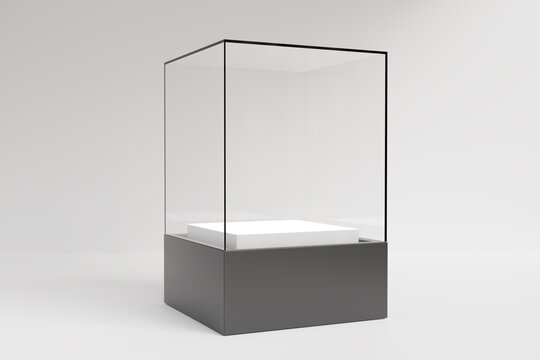 Empty glass display case showcase with black base and white podium isolated on light gray background. 3D render.
