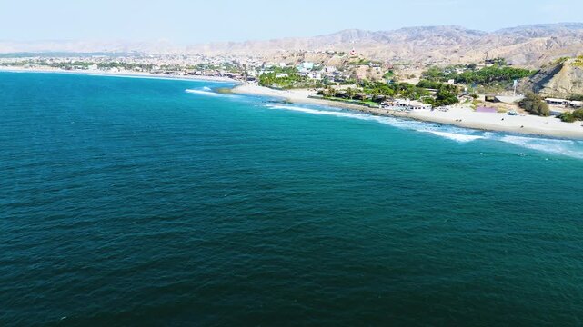 Aerial View of Ecuador Pacific Coastline with Sandy Beach, Ocean Waves, Coastal Town and Dry Hills, Scenic Tropical Seascape Travel Background