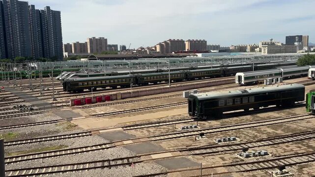 Aerial view of railway tracks at train station. Industrial transportation infrastructure with multiple parallel rails. Logistics and urban transit system for passenger and cargo travel.
