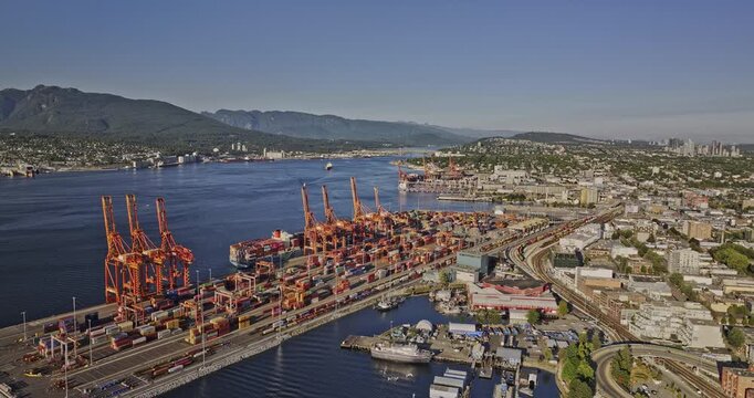 Vancouver BC Canada Aerial v37 drone flyover Downtown Eastside capturing industrial shipyard, cruise ship sailing on the harbour and North shore mountain views - Shot with Mavic 3 Pro Cine - July 2023