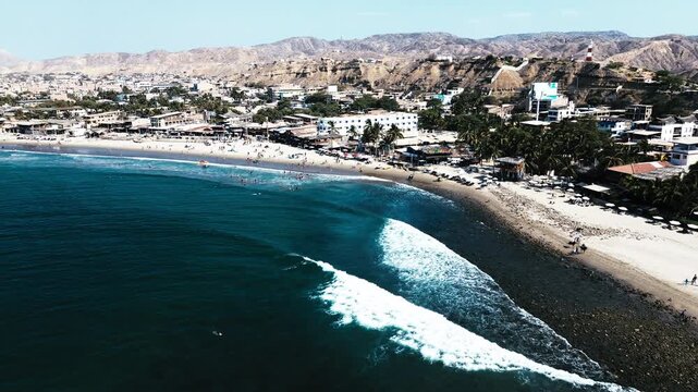 Drone View of Sandy Ecuador Beach with Ocean Waves, Coastal Town, Dry Hills and Tropical South American Seascape Travel Destination