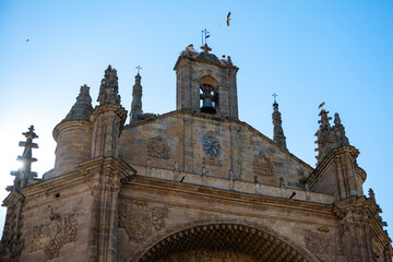 Obraz premium White Stork Ciconia Ciconia Nesting on the Historic Stone Bell Gable of a Church Roof in Salamanca Spain