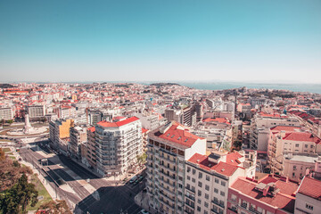 Obraz premium panoramic view captures the cityscape of Lisbon, Portugal, looking down towards the historic center and the Tagus River
