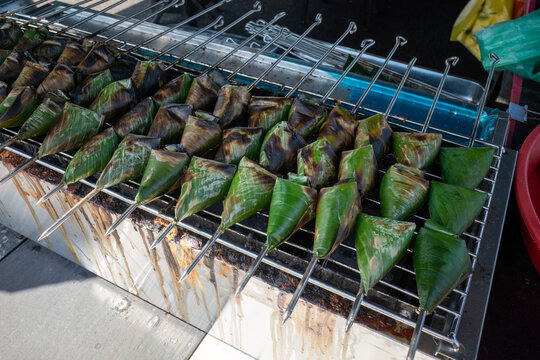 Traditional Malaysian Sata fish cakes wrapped in banana leaves grilled on skewers