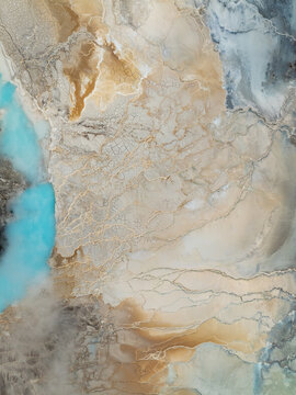 Aerial view of the geothermal landscape at Reykjanes with vibrant blue mineral-rich water pools, intricate cracked earth patterns, and steaming vents, Grindavikurbaer, Iceland.