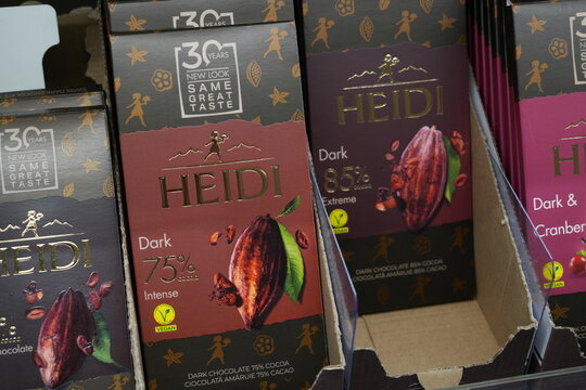 Premium Heidi dark chocolate bars on a store shelf.