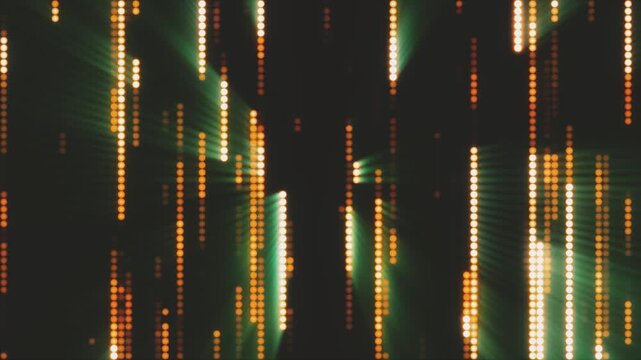 Vertical matrix rain of glowing gold and green LED dots. Festive digital waterfall or data code background.
