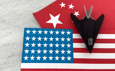 Fototapeta premium Toy airplane fighter bomber with China flag background
