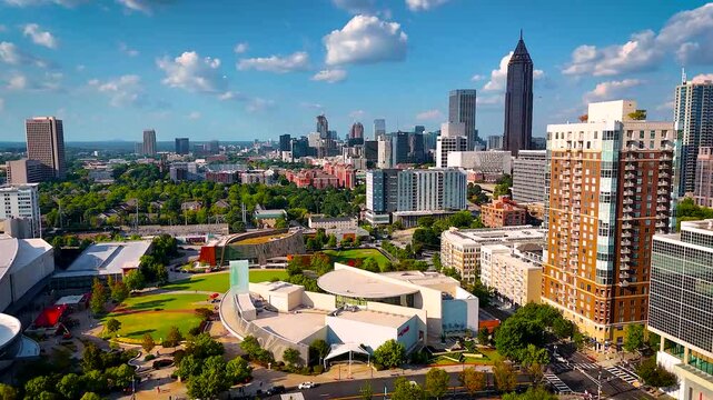 Vibrant aerial photo of Atlanta, Georgia showcasing downtown skyscrapers, Centennial Olympic Park, and green urban spaces. Perfect for real estate, travel, tourism, and business visuals