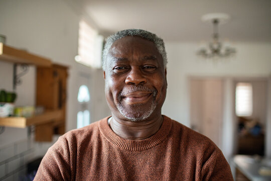 Smiling senior man portrait at home