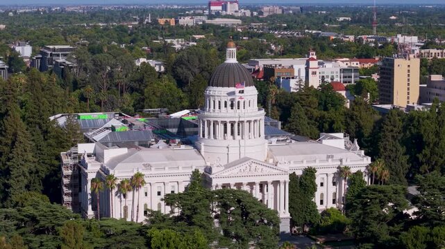 Aerial views show the west side of California State Capitol in Sacramento with the new annex being built to the east of the historic site