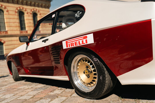 Berlin, Germany - May 3, 2026. Pirelli decal on modified Ford Capri at car exhibition.
