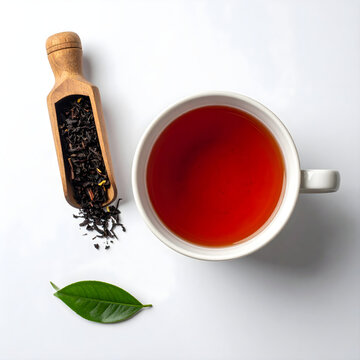 Top view of red cup of morning tea with fresh tea leaf on white background