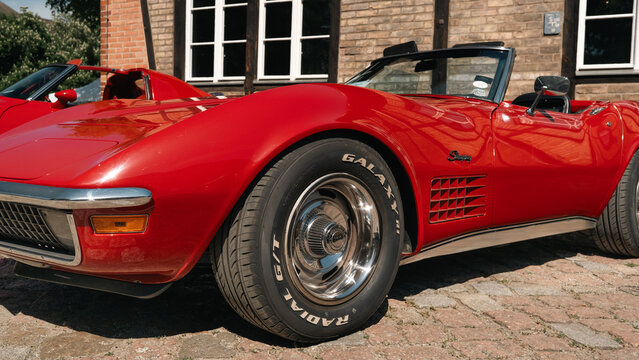 Berlin, Germany - May 3, 2026. Red classic sports car side detail at oldtimer show.