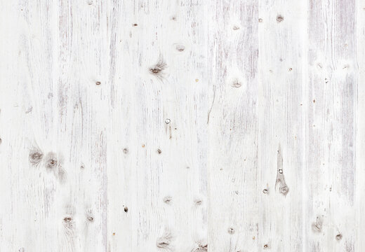 Peeling paint on an old  white wooden floor. Grunge background.