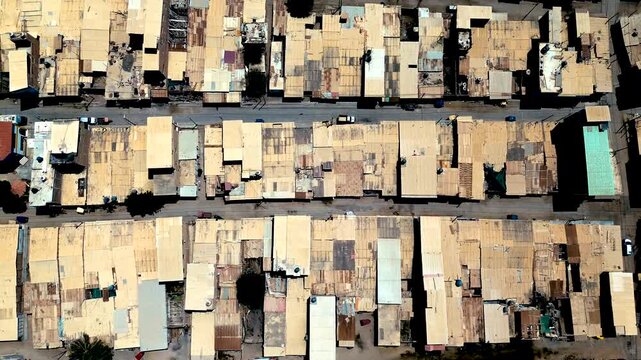 Top Down Drone View of Dense Coastal City Rooftops in Ecuador, Repeating Urban Blocks, Narrow Streets and Residential Architecture Pattern