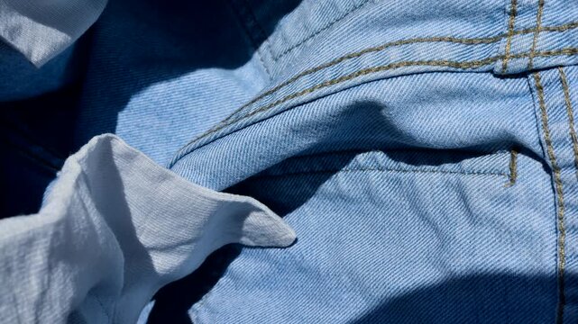 Exquisite stitching detail on denim, capturing the craftsmanship and unique texture of the fabric.