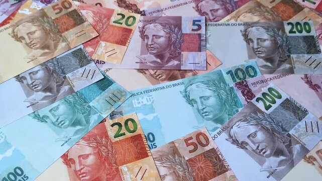 Brazilian paper money, real banknotes as currency for exchange or travel. Brazilian money as a business background