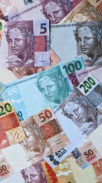 Brazilian paper money, real banknotes as currency for exchange or travel. Brazilian money as a business background