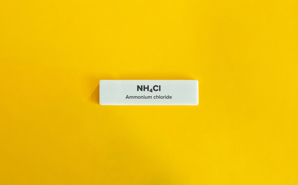 Ammonium chloride chemical formula on a yellow background