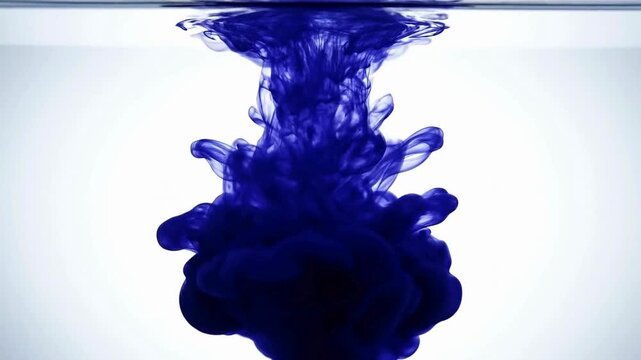 Dark blue ink swirling underwater in 4k quality for video and sales