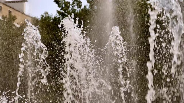Sparkling Water Fountain Jets Spraying Outdoors in Sunlight