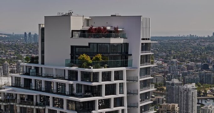 Vancouver BC Canada Aerial v114 zoomed drone fly around One Burrard Place apartment in downtown capturing urban cityscape and North shore mountain views - Shot with Mavic 3 Pro Cine - July 2023