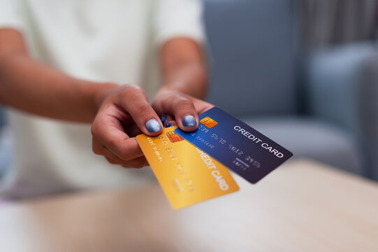 Individual managing finances showcasing various credit cards and emphasizing responsible spending