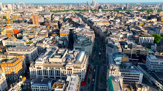 High-angle aerial shot of Regent Street, London&rsquo;s iconic shopping and business avenue, with curved facades, traffic, and city activity. Ideal for travel, retail, and urban business projects.