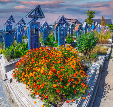 SAPANTA, MARAMURES, ROMANIA - SEPTEMBER 18, 2020: The Merry Cemetery, famous in the world for its colourful wood tombstones, with naive paintings describing the people who are buried there.