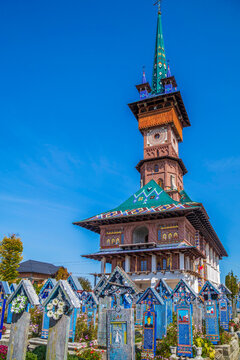 SAPANTA, MARAMURES, ROMANIA - SEPTEMBER 18, 2020: The Merry Cemetery, famous in the world for its colourful wood tombstones, with naive paintings describing the people who are buried there.