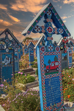 SAPANTA, MARAMURES, ROMANIA - SEPTEMBER 18, 2020: The Merry Cemetery, famous in the world for its colourful wood tombstones, with naive paintings describing the people who are buried there.
