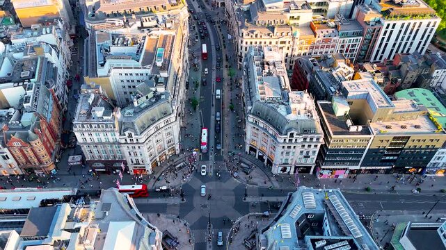High-angle aerial of Oxford Circus, London&rsquo;s major shopping and business hub, with busy roads, classic buildings, and red buses. Perfect for travel, retail, and urban lifestyle projects