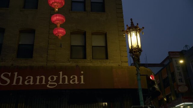 Chinatown Ornate Street Lamp With Red Lanterns On Brick Building At Dusk