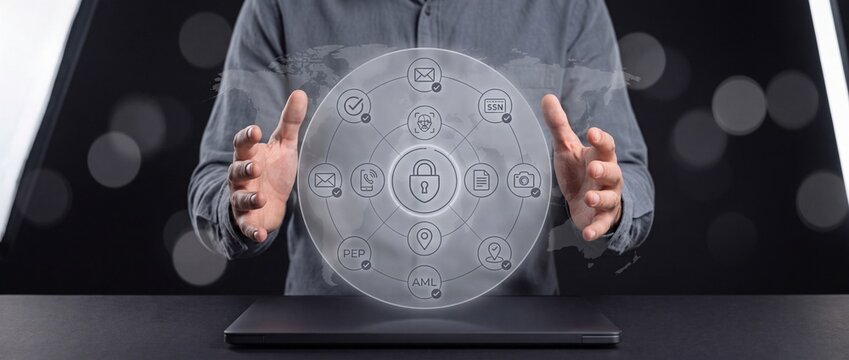 Professional businessman protecting digital data privacy and cybersecurity with advanced holographic interface technology for secure global network information management