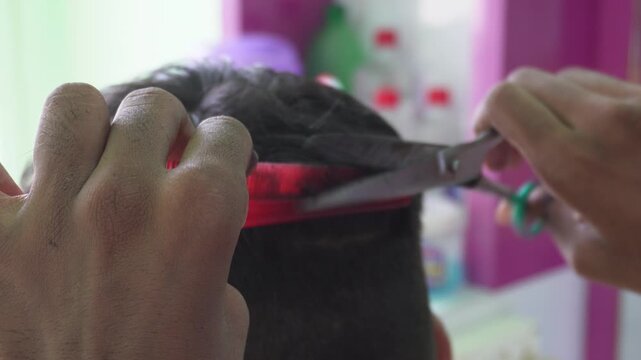 Stylish haircut by professional hairstylist close up