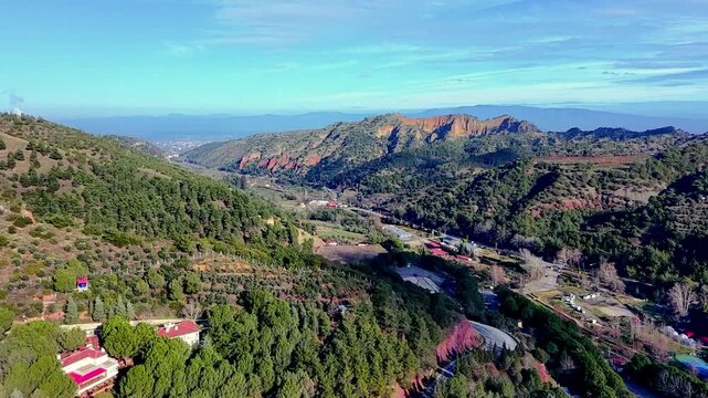 Forested ridges and settlements with access routes for geographic research land use planning and tourism