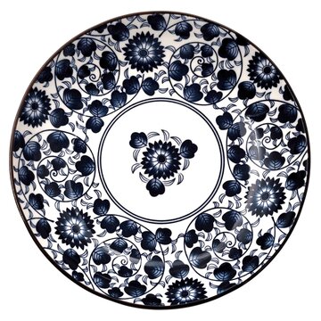 Top view of a traditional Chinoiserie ceramic plate featuring intricate blue and white chrysanthemum floral patterns with detailed indigo scrollwork and classic cobalt blue Asian motifs.