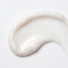 Obraz premium A thick creamy white cosmetic face scrub smear with tiny exfoliating particles captured in bright studio lighting from above view