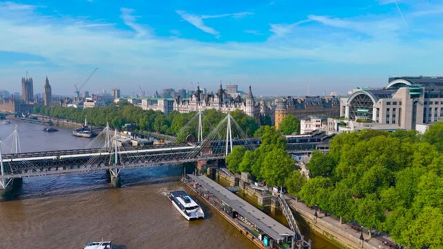Drone image of Charing Cross Station in London, highlighting its modern arched design, train tracks, and prime urban location. Great for transport, travel, and infrastructure themes
