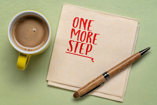 One More Step - inspirational handwritten note on a napkin with coffee and pen, symbolizing perseverance, resilience, steady progress, and determination.