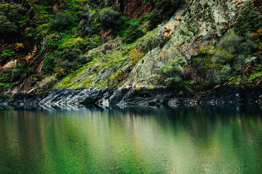 Steep Canyon Wall and Water