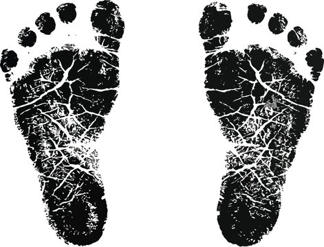 Two detailed black ink baby footprints stamped onto a clean white paper surface for artistic projects