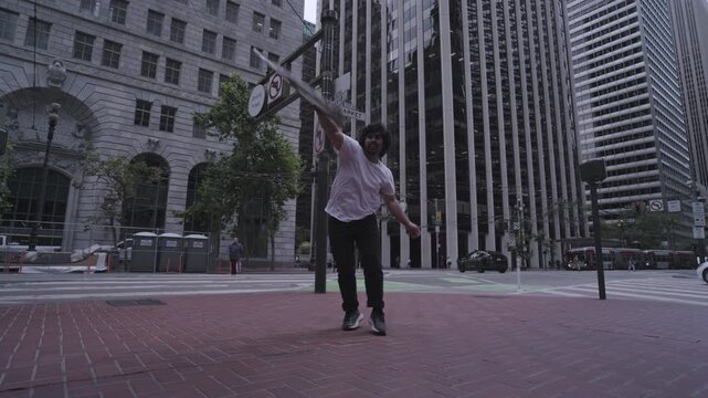 Man Spinning Colored Sign In Plaza Of San Francisco - Low Shot