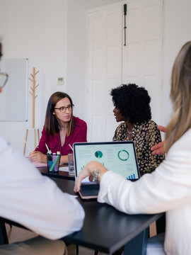 Colleagues are having serious conversation at meeting 