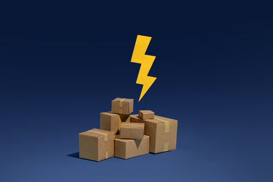 Pile of cardboard boxes with a yellow lightning bolt symbol