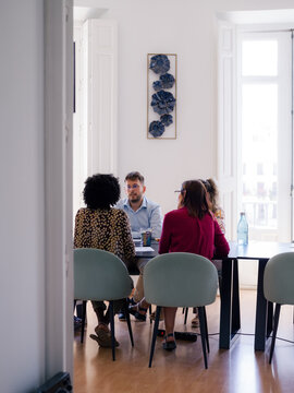 Group of business people discussing project in office 